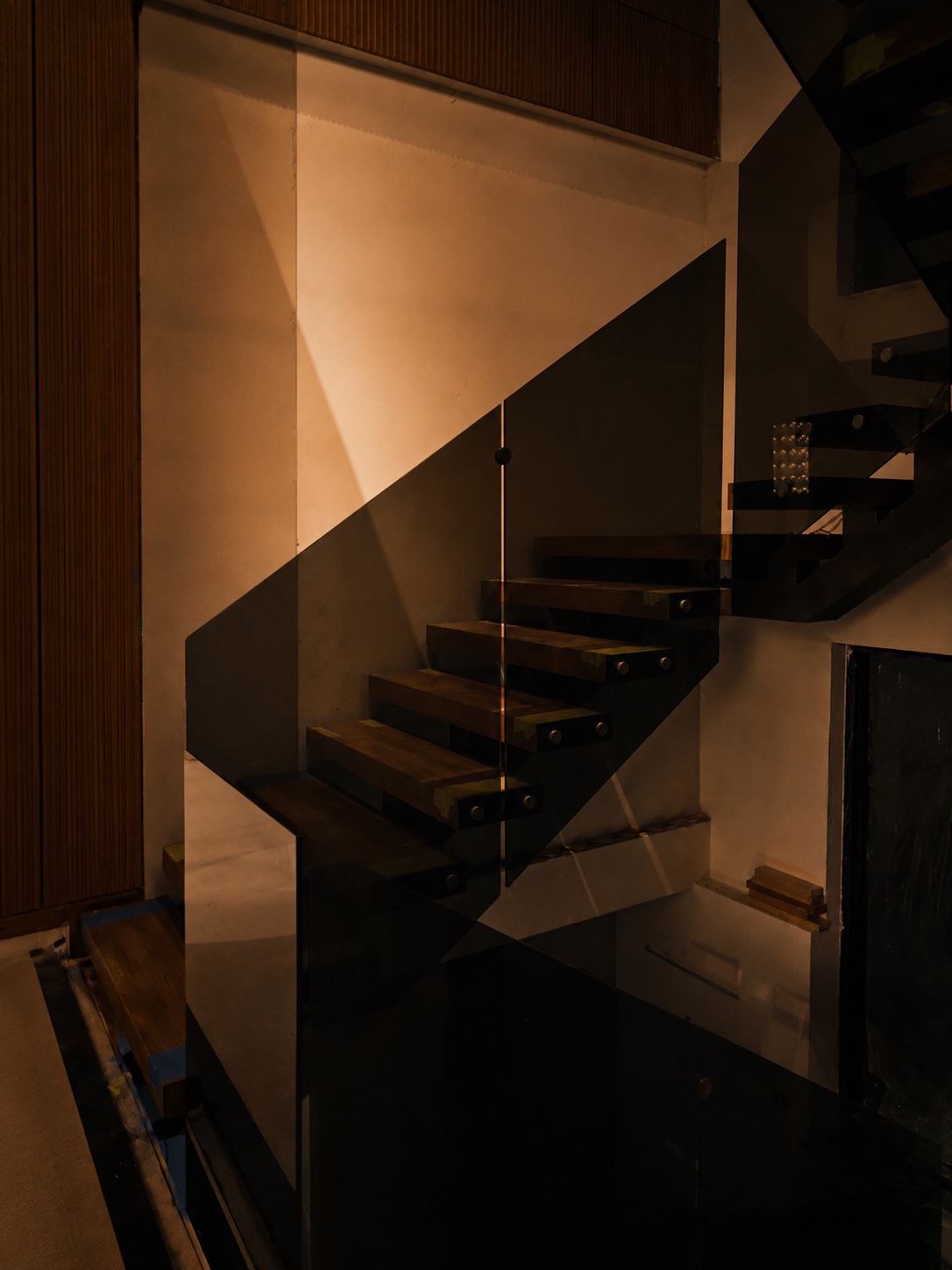 Architectural staircase in warm light and shadow